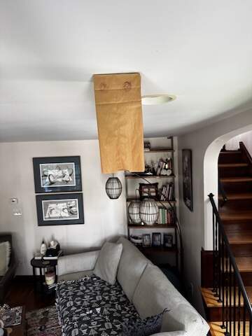 a brown paper bag with a drawing of a jellyfish hanging from a living room ceiling